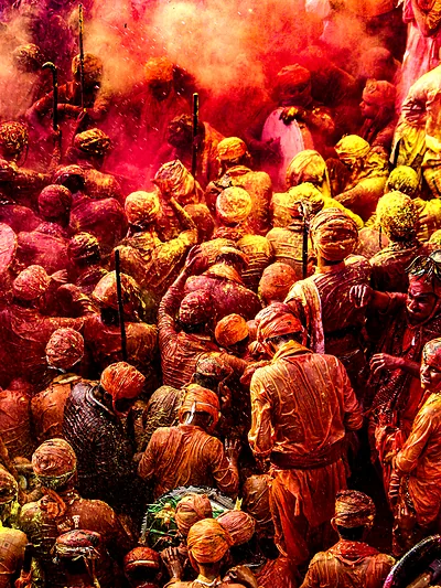 Crowds drenched in colour at a Holi celebration