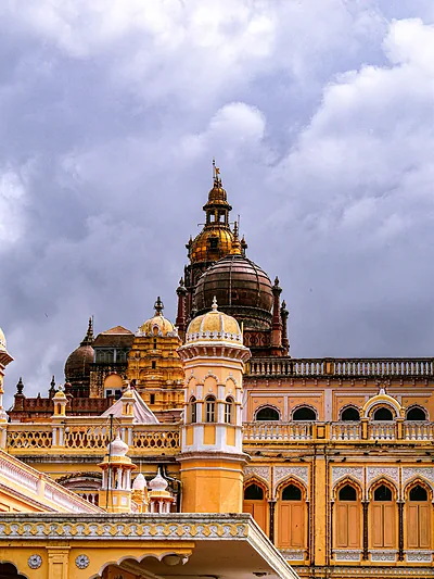 The domes of Mysore Palace under a stormy sky