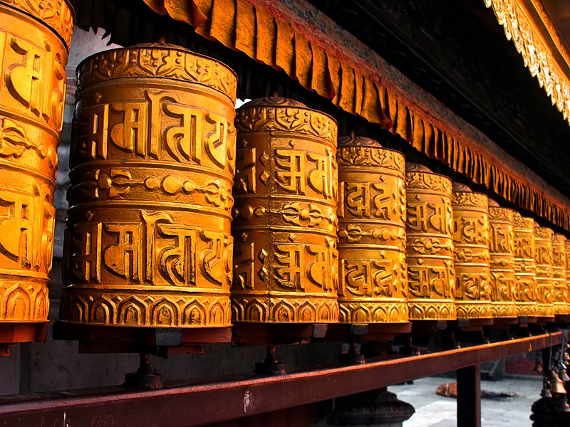 Rows of golden prayer wheels, Kathmandu, Nepal