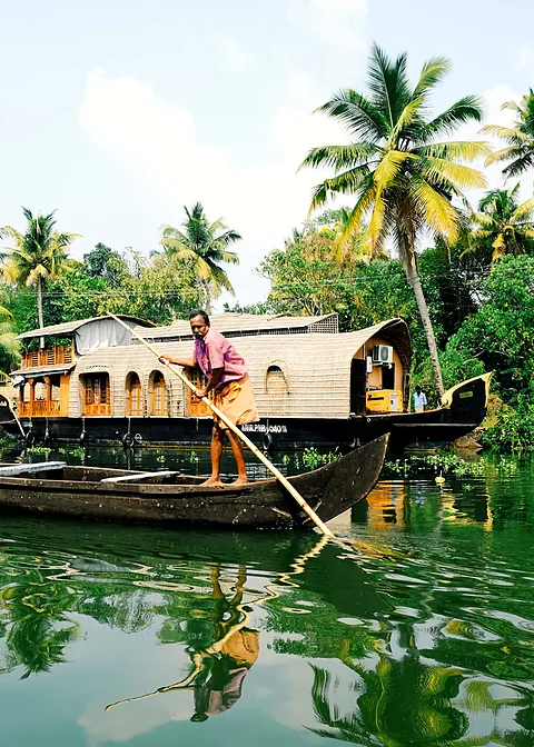 Houseboat among palm trees on the Kerala backwaters